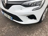 a picture of a white car parked in a parking lot