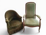 pair of green velvet armchairs with fringed arms