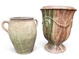 two vases sitting next to each other on a white surface