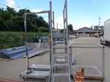 a ladder that is sitting in the middle of a parking lot