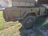 a military truck that is parked in the grass
