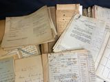 a pile of old papers sitting on top of a table