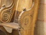 two wooden benches sitting next to each other in a room