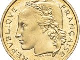 a close up of a coin with a woman ' s face on it