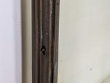 a mirror that has a hole in the middle of it