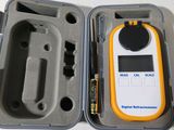 a plastic case with a digital thermometer inside of it