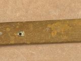 a small metal object with holes on it on a table