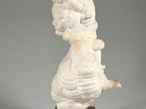 sculpture of a woman holding a baby on a wooden base