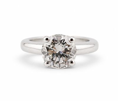 a white gold engagement ring with a round brilliant cut diamond
