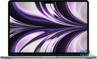 an image of a laptop computer with a purple swirl design on the screen