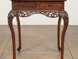 an old wooden table with a drawer on top of it