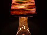 a lamp that is sitting on a table in the dark