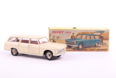 toy car in front of a box with a picture of a man in the back