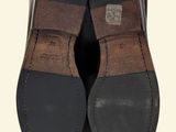 men ' s brown and black slippers with a brown stripe