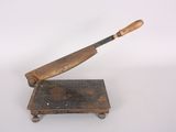 a small wooden object with a baseball bat on it