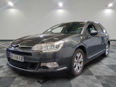 a picture of a grey citrole parked on a checkered floor