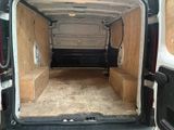 the inside of a van with the door open and the interior of the van in the back