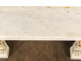 an image of a marble table on a wooden floor