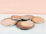 a pile of coins sitting on top of a table