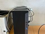a desktop computer sitting on top of a wooden desk