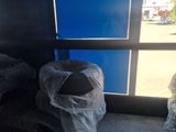 a blue door that has a trash bag in it