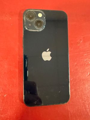 an apple iphone is sitting on a red surface next to a red wall