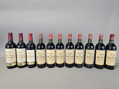 six bottles of wine lined up in a row on a table