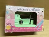 a box with a sewing machine in it on a table