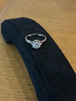 a ring that is sitting on top of a black tie
