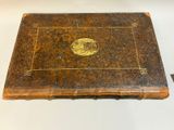 an old book that is sitting on a table