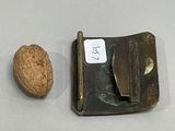 an image of a walnut and a knife on a table