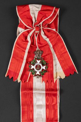 an image of a red and white ribbon with a star on it