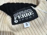 black and white striped sweater with a black and white label on it