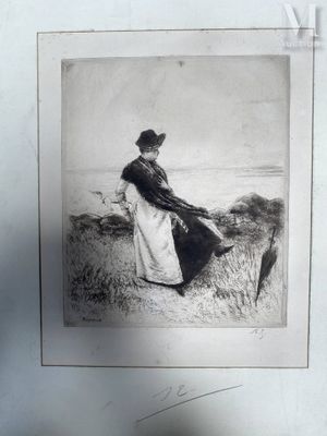 a black and white photo of a woman sitting on a hill