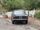 a car that is parked in the driveway of a house