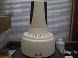 a white and black machine sitting on top of a desk