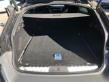 a trunk of a car with the back door open