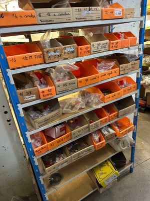many boxes of assorted items on the shelves