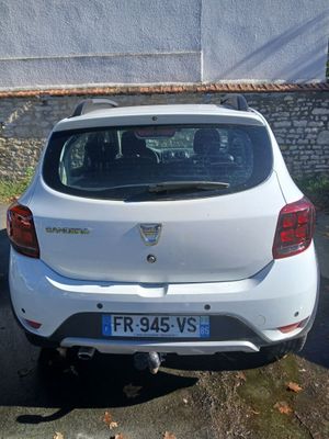 a white car parked on the side of the road