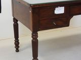 a small desk with a glass top and wooden legs