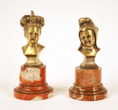 pair of antique bronze busts of a woman and a man
