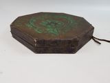 a small wooden box with a green design on it