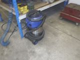 a picture of a room with a lot of tools on the shelves
