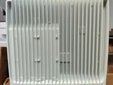a white radiator sitting on top of a cardboard box