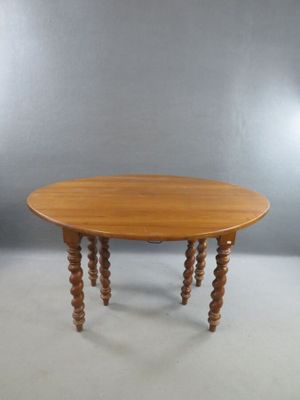 Table ronde à volets en merisier, reposant sur 6 pieds torsa…