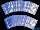 a lot of pokemon cards on a black background