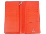 a close up of a red wallet with a zipper on it