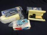 a small toy car in a box next to a small car in a box