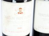 two bottles of wine sitting next to each other on a table