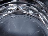 a close up view of a silver vase with a black background